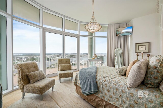 26302 Perdido Beach Blvd Unit D2201, Orange Beach, AL 36561 - bedroom featuring floor to ceiling windows and wood finished floors