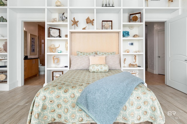 26302 Perdido Beach Blvd Unit D2201, Orange Beach, AL 36561 - bedroom with wood finished floors and connected bathroom