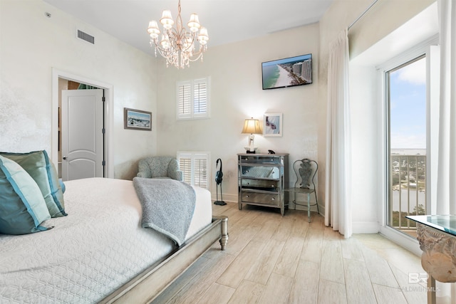 26302 Perdido Beach Blvd Unit D2201, Orange Beach, AL 36561 - bedroom with a chandelier, light wood finished floors, and baseboards