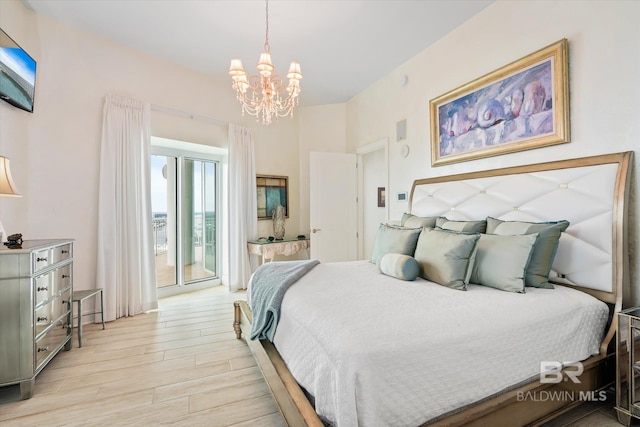 26302 Perdido Beach Blvd Unit D2201, Orange Beach, AL 36561 - bedroom with light wood-style flooring, a chandelier, and access to outside
