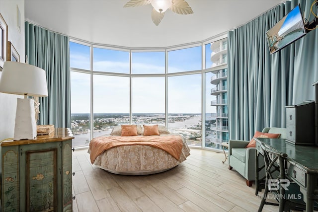 26302 Perdido Beach Blvd Unit D2201, Orange Beach, AL 36561 - bedroom featuring expansive windows, light wood-style flooring, ceiling fan, and access to exterior