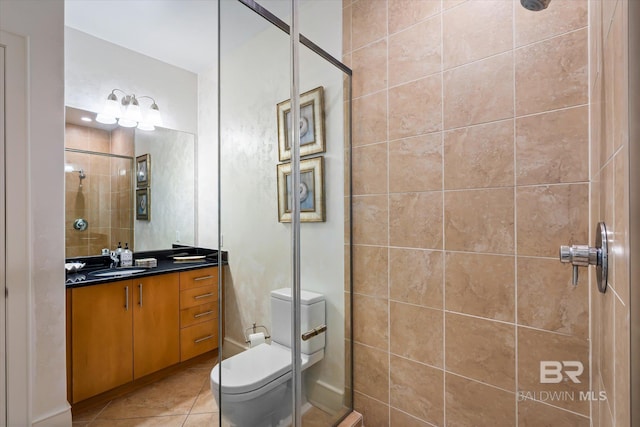 26302 Perdido Beach Blvd Unit D2201, Orange Beach, AL 36561 - full bath featuring a tile shower, vanity, tile patterned floors, and toilet