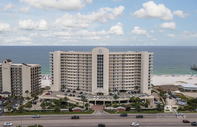 birds eye view of property featuring a water view and a view of the beach