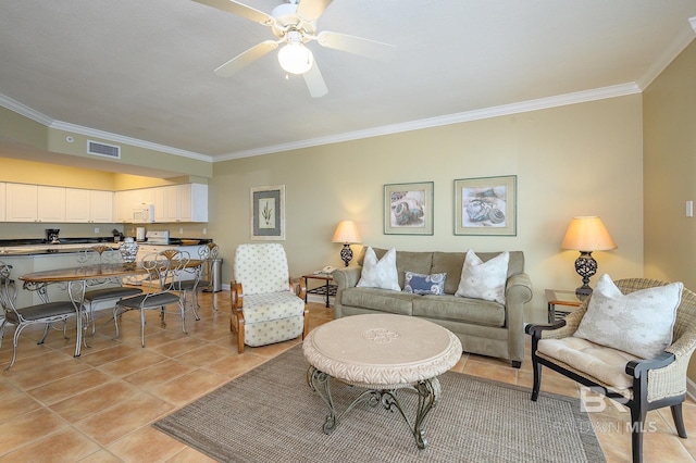 living room with ceiling fan, light tile patterned floors, and crown molding