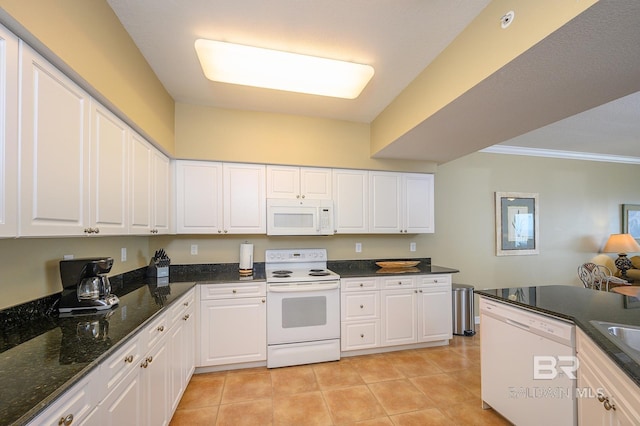 kitchen with white cabinets, light tile patterned floors, and white appliances