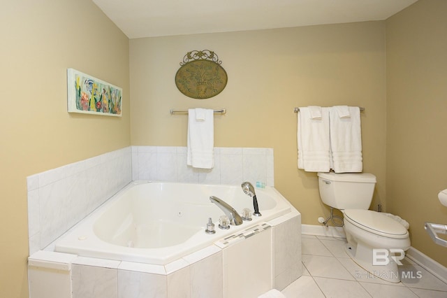 bathroom with tile patterned floors, toilet, and tiled bath