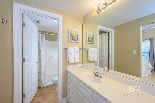 full bathroom featuring shower / bathtub combination with curtain, tile patterned flooring, a textured ceiling, toilet, and vanity