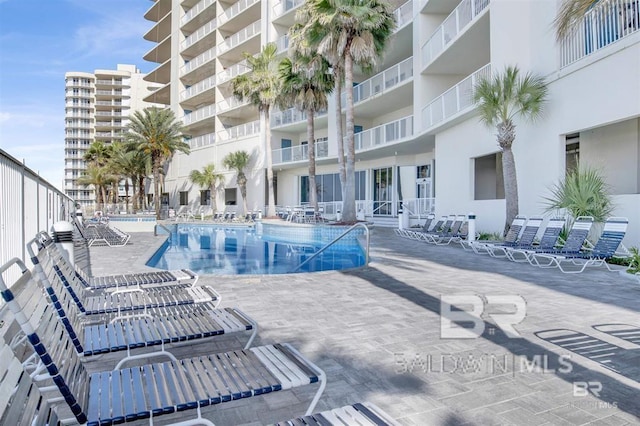 view of swimming pool with a patio area