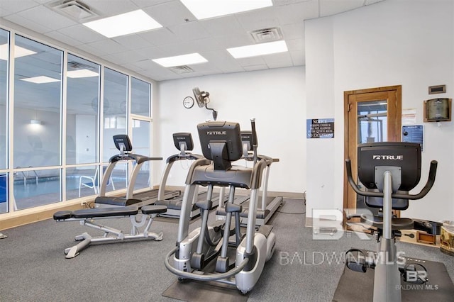 workout area with a drop ceiling