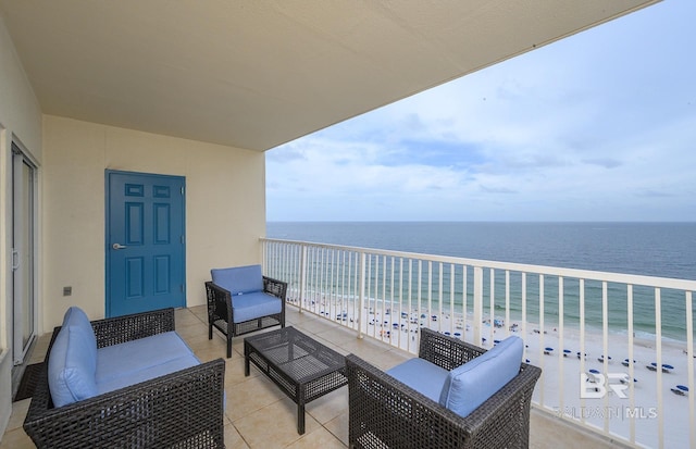 balcony featuring an outdoor living space, a view of the beach, and a water view
