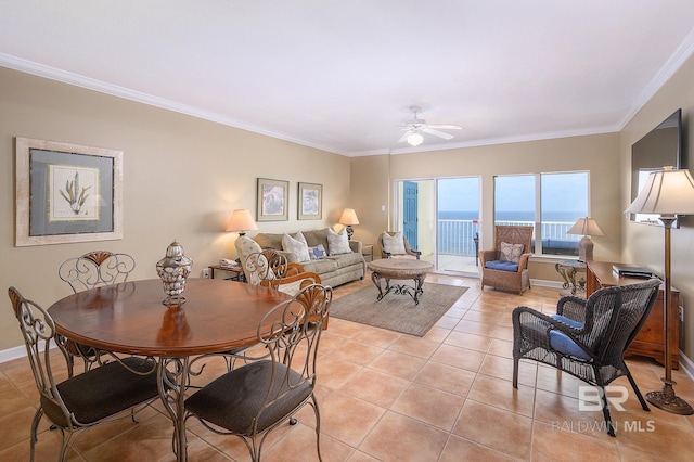 living room with ceiling fan, crown molding, and light tile patterned floors