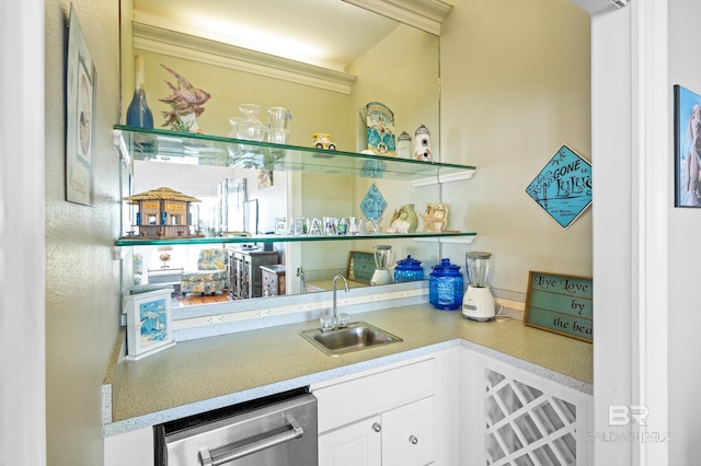 bar with dishwasher, white cabinetry, sink, and ornamental molding