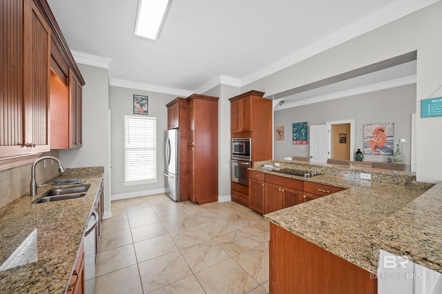 kitchen featuring kitchen peninsula, appliances with stainless steel finishes, light stone counters, ornamental molding, and sink