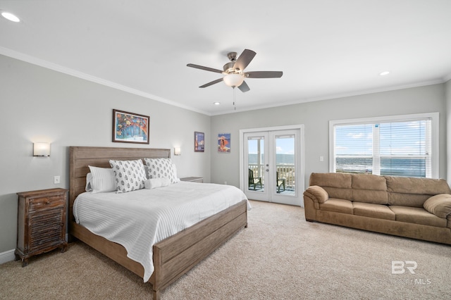 bedroom featuring access to exterior, french doors, light colored carpet, ceiling fan, and crown molding