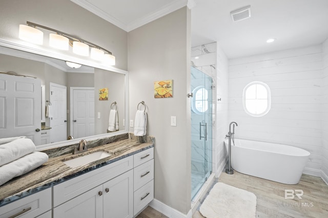 bathroom with vanity, shower with separate bathtub, wood-type flooring, and crown molding