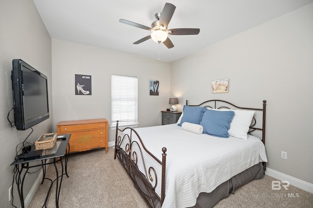 bedroom featuring light carpet and ceiling fan