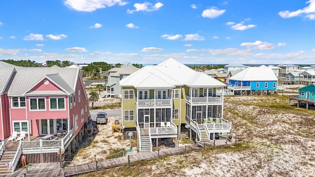 back of property featuring a balcony