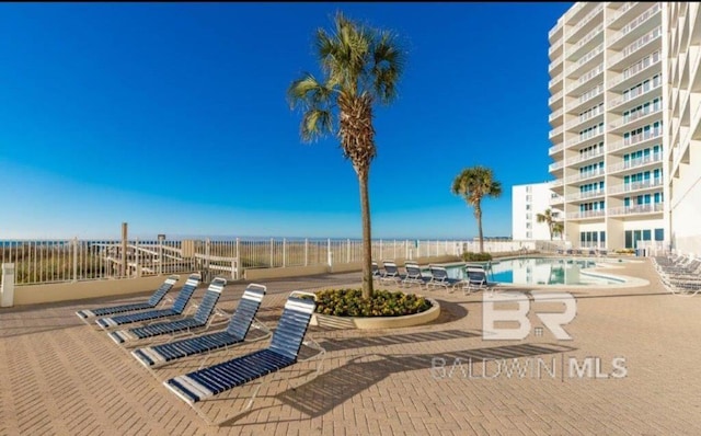 455 E Beach Blvd Unit 318, Gulf Shores, AL 36542 - community pool featuring a patio area