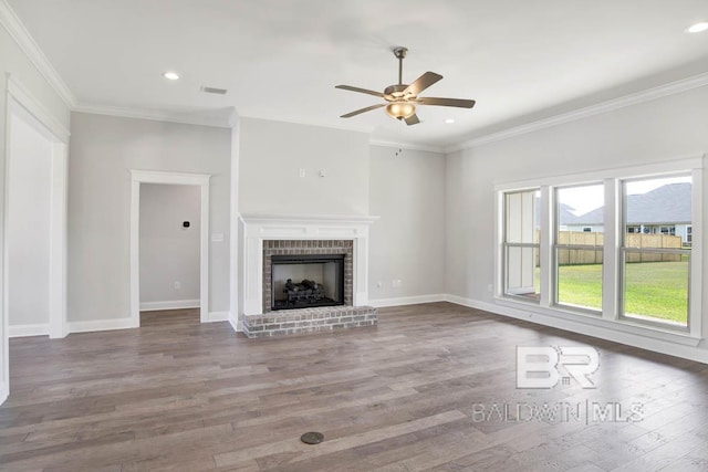 384 Garrison Blvd, Fairhope, AL 36532 - unfurnished living room featuring a ceiling fan, wood finished floors, a brick fireplace, ornamental molding, and recessed lighting