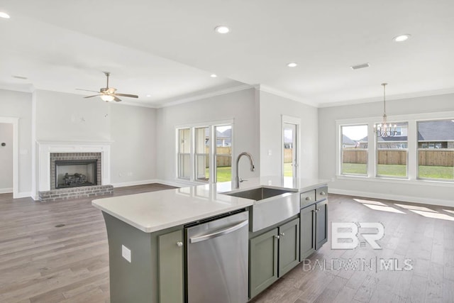 384 Garrison Blvd, Fairhope, AL 36532 - kitchen with stainless steel dishwasher, ceiling fan, light wood-style floors, recessed lighting, and a kitchen island with sink