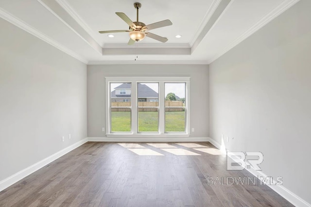 384 Garrison Blvd, Fairhope, AL 36532 - spare room with a raised ceiling, wood finished floors, ceiling fan, and crown molding