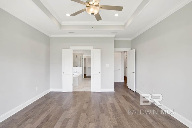 384 Garrison Blvd, Fairhope, AL 36532 - unfurnished bedroom with a raised ceiling, wood finished floors, ornamental molding, and a ceiling fan