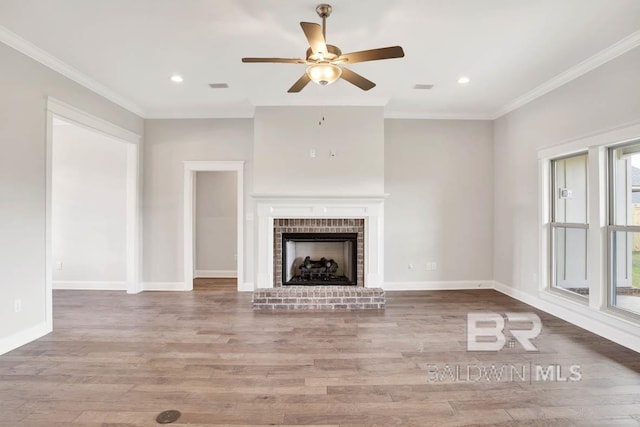 384 Garrison Blvd, Fairhope, AL 36532 - unfurnished living room with a ceiling fan, wood finished floors, crown molding, a brick fireplace, and recessed lighting