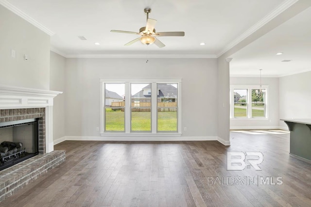 384 Garrison Blvd, Fairhope, AL 36532 - unfurnished living room featuring a fireplace, a ceiling fan, dark wood-style flooring, crown molding, and recessed lighting