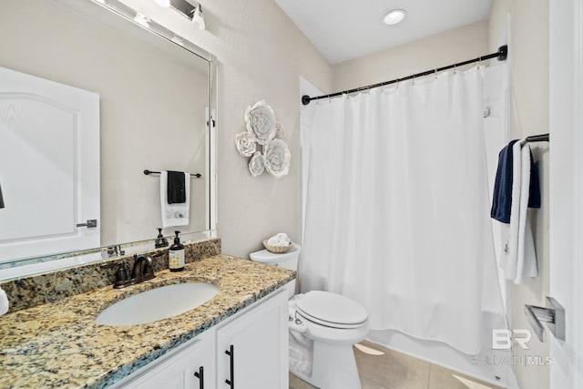 bathroom featuring vanity, toilet, and tile flooring