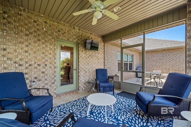 exterior space featuring grilling area, outdoor lounge area, and ceiling fan