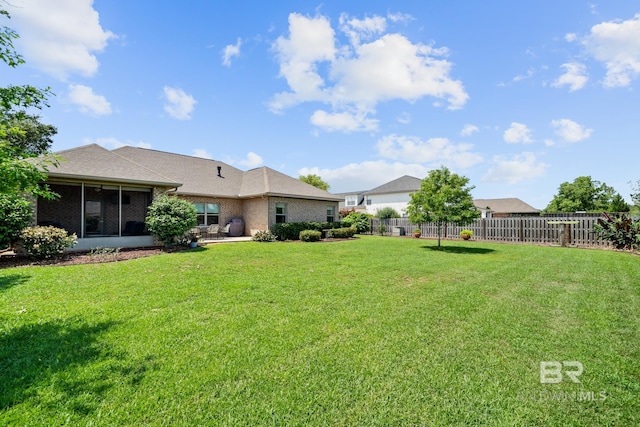 view of yard with a sunroom