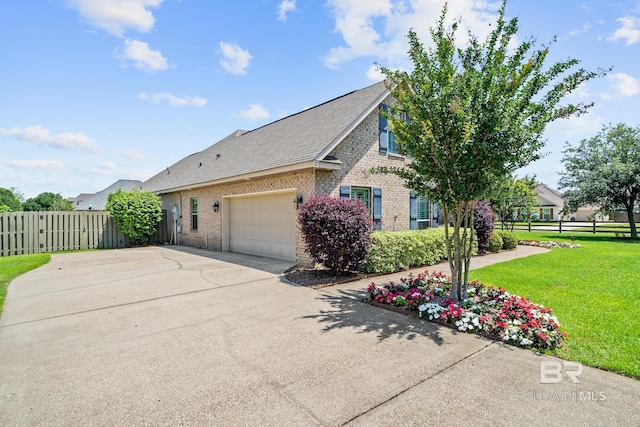 view of property exterior featuring a yard and a garage