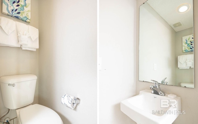 bathroom featuring sink and toilet