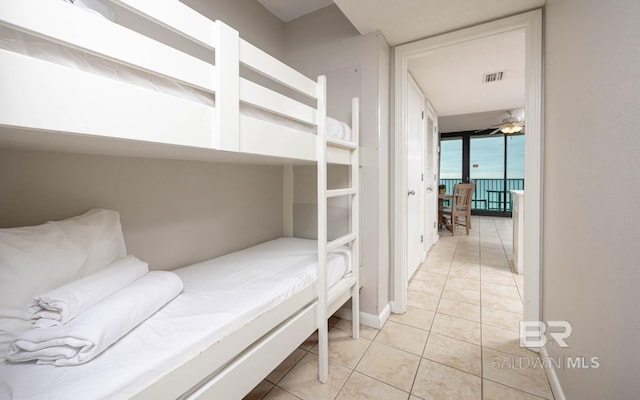 bedroom with light tile patterned flooring