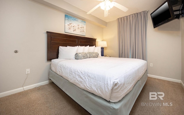 bedroom with ceiling fan and carpet flooring