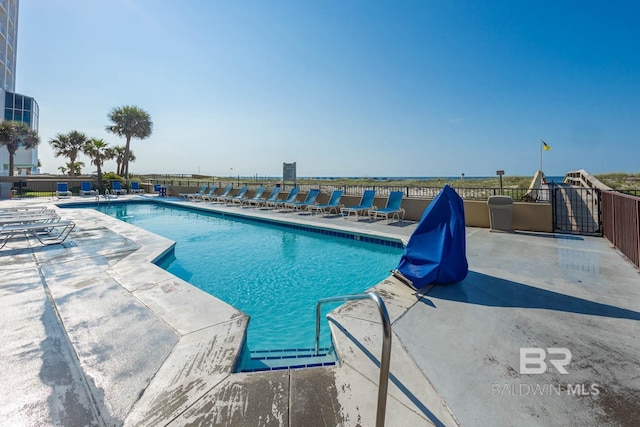 view of swimming pool featuring a patio area