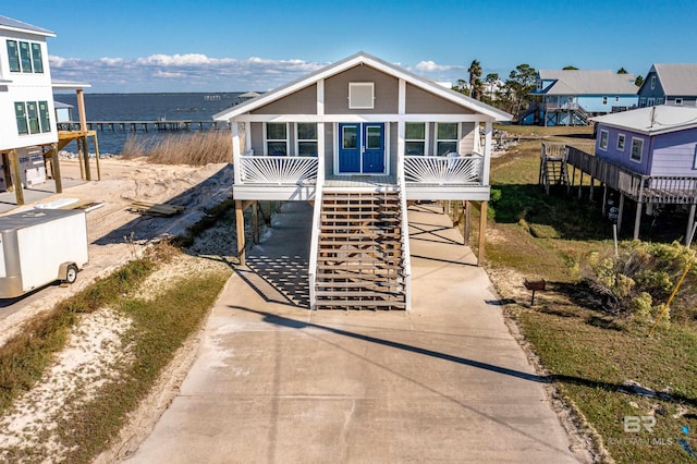 view of front of home featuring a carport and a water view