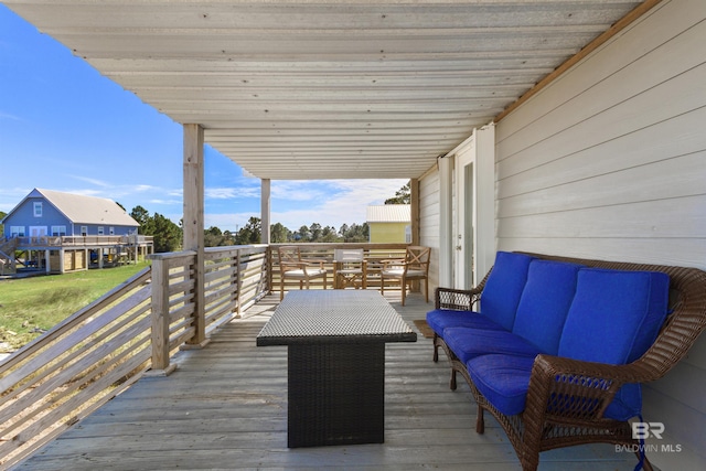 wooden terrace with outdoor lounge area