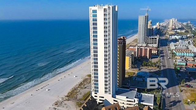 aerial view featuring a view of the beach and a water view