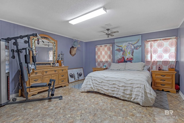 bedroom with visible vents, a textured ceiling, crown molding, and a ceiling fan