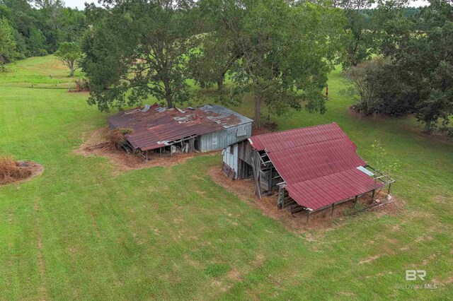 birds eye view of property with a rural view