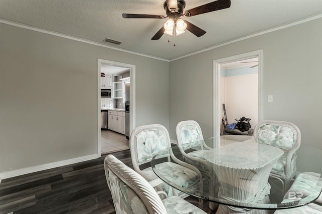 dining space featuring ornamental molding, dark hardwood / wood-style flooring, and ceiling fan