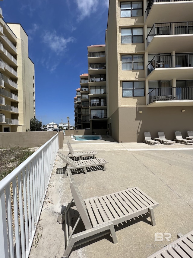 view of property's community with a patio