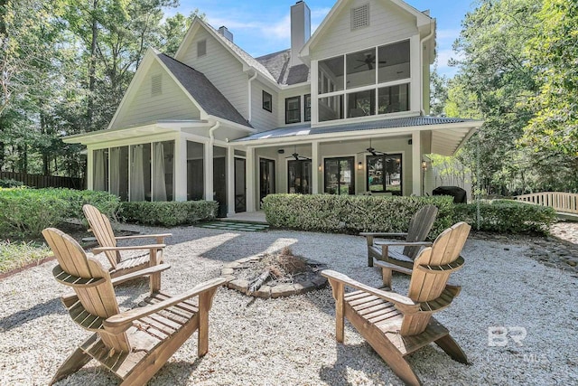 1106 Old County Rd, Daphne, AL 36526 - back of house with a fire pit, a ceiling fan, a sunroom, and a chimney