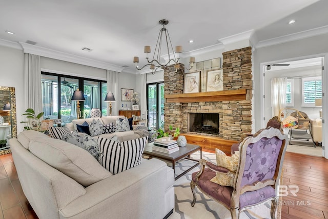 1106 Old County Rd, Daphne, AL 36526 - living room featuring crown molding, visible vents, a healthy amount of sunlight, and a fireplace
