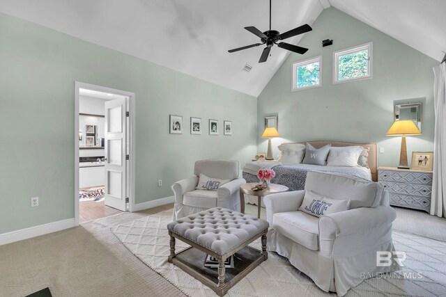 1106 Old County Rd, Daphne, AL 36526 - bedroom with connected bathroom, light colored carpet, high vaulted ceiling, baseboards, and visible vents
