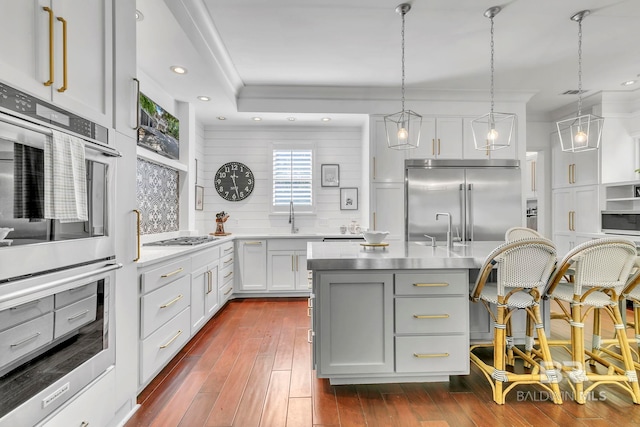 1106 Old County Rd, Daphne, AL 36526 - kitchen featuring backsplash, dark wood-style flooring, appliances with stainless steel finishes, light countertops, and a sink