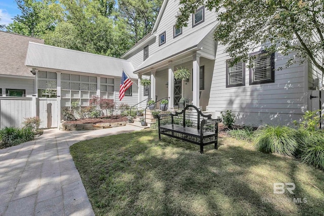 1106 Old County Rd, Daphne, AL 36526 - view of front of home with fence, covered porch, and a front yard