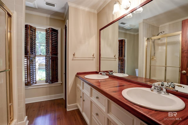 bathroom with plenty of natural light, toilet, vanity, and wood-type flooring