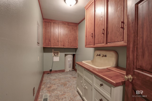 clothes washing area featuring washer hookup, water heater, cabinets, and sink